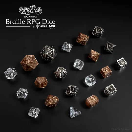 3 sets of 7 TTRPG polyhedral dice on a black surface. The first set for size comparison is a standard numbered clear plastic with silver numbers. The braille sets are metallic bronze plastic with dark pearl swirls and silver metal with black antiqued finish. Most of the braille dice are similar in size to standard numbered sets with the d20 being almost double the size. Both braille dice sets are the same style, using a single character per face on all dice. The edges around all dice faces are raised with one border having a small divot in the center to act as an orientation marker, signifying the bottom of a braille cell. The other edges around the face set are flatter and thicker to provide increased stability when reading. The metal set has small holes in the corner of all faces as the die is completely hollow. Logo in the top left corner reads DOTS RPG Project Braille RPG Dice by Die Hard Dice, US & CN Patent Pending in bottom right corner.
