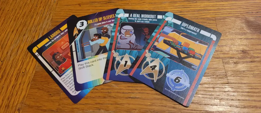 an example of the cards in one hand. the hand contains two Alpha Shift Ability cards and two Side Project cards