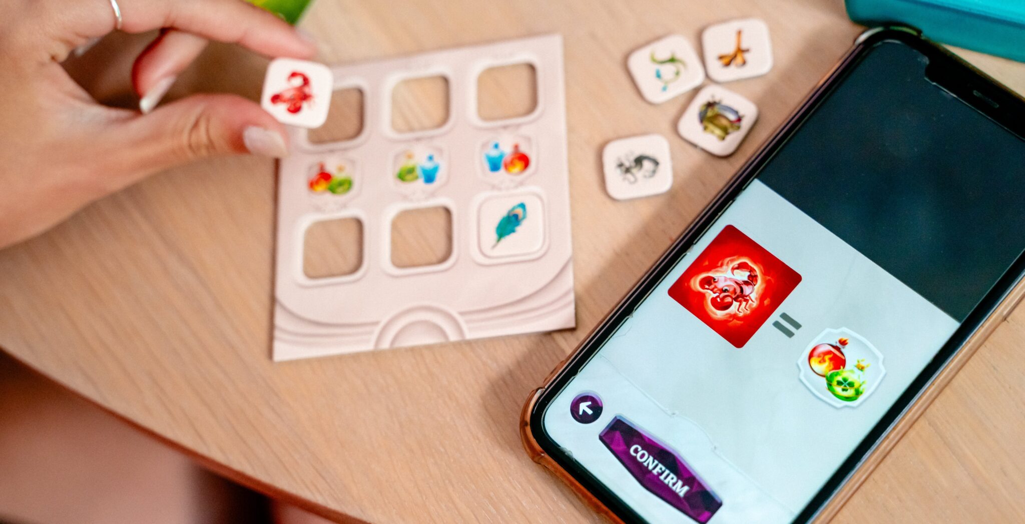 image of playing tiles next to a smart phone.