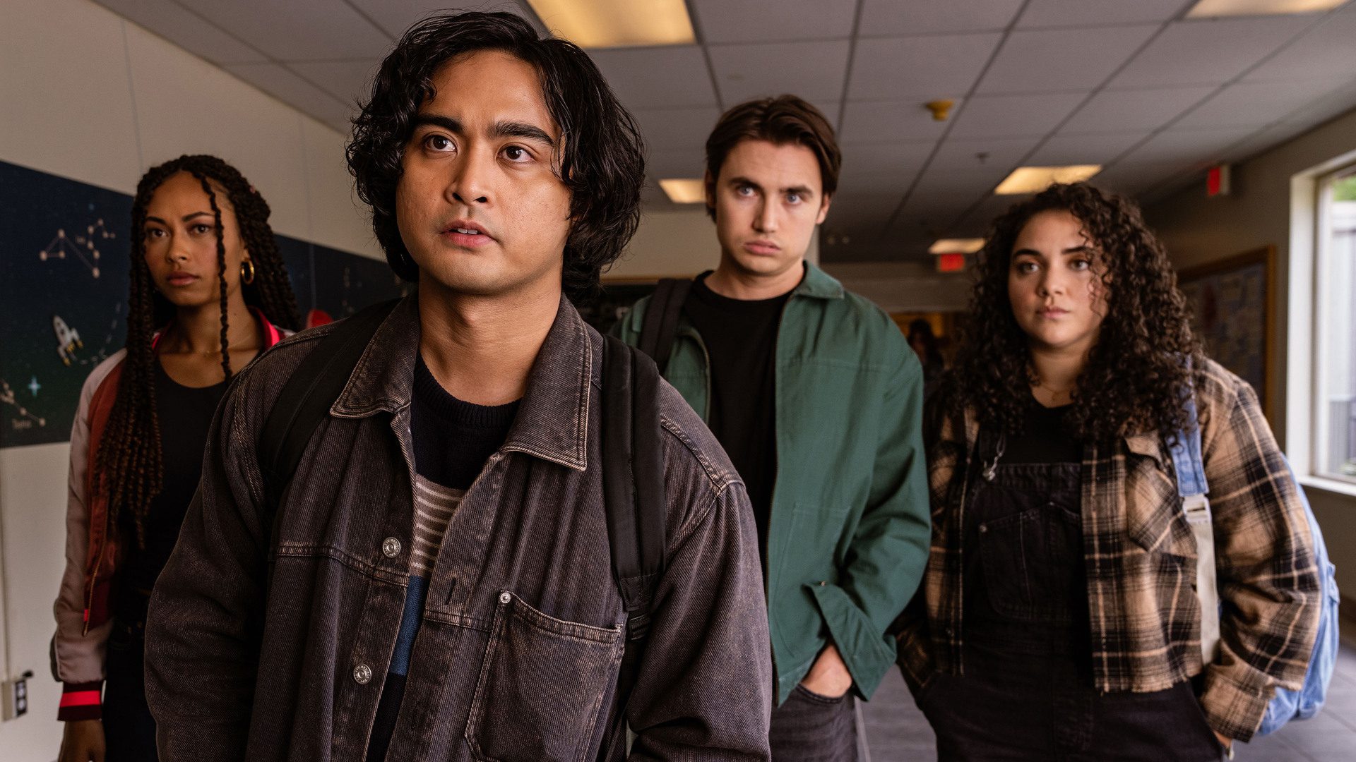 Kristian Ventura, Rainbow Wedell, Spencer MacPherson, and Kiara Pichardo of School Spirits in a classroom. 