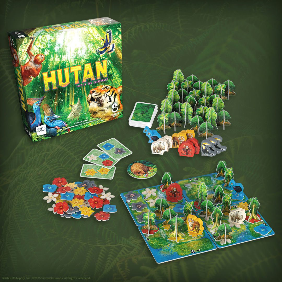 Hutan board with components: trees, flowers of various colors, and animals. The front of the Hutan box is in the background. 